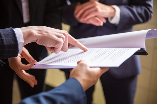 cropped-view-businesswomen-reading-document